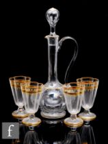 A set of four Moser type wine glasses with quatrelobed bowl with gilding and floral enamel, together