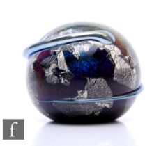 A contemporary Richard P. Golding glass paperweight, of domed form, internally decorated with a