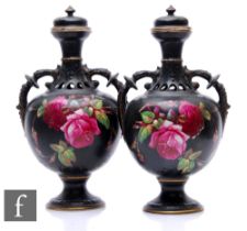 A pair of late 19th Century Staffordshire vases by John Tams, the pedestal body with open foliate