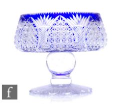 A large early 20th Century Stourbridge crystal glass pedestal bowl cased in blue and flash cut