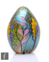 A contemporary Richard P. Golding glass paperweight, of egg form, decorated to the surface with