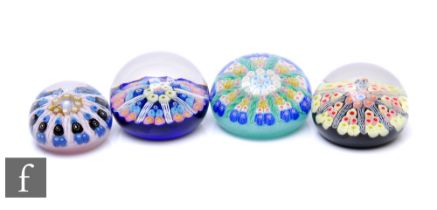 A later 20th Century Strathearn glass paperweight, of domed form, internally decorated with a