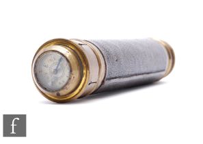 A late 19th Century pocket three drawer brass telescope, the end cap with compass attachment, length