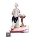 A 18th Century continental hard paste Ludwigsburg porcelain figure of a seated gentleman