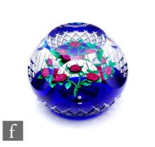 A later 20th Century Ray Banford glass paperweight, of domed form with facet cut sides and top,