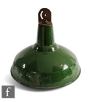 A 20th Century industrial green and white enamelled ceiling light of domed form, height 35cm.