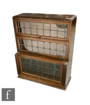 A 1930s oak glazed leaded light three sectional bookcase height 108cm x depth 37cm x width 90cm