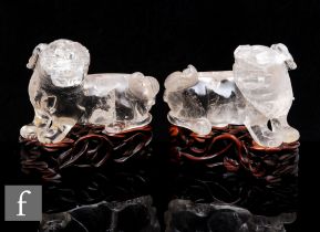 A pair of 19th Century Chinese rock crystal shishi, modelled in standing position, head turned in