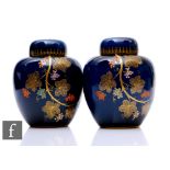 A pair of late 1930s Carlton Ware ginger jars and covers decorated in the Grape Vine pattern with