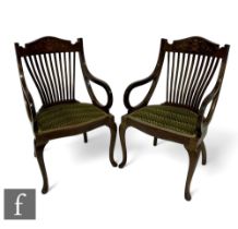 A pair of Edwardian marquetry inlaid slat back drawing room chairs, the pierced splats below an