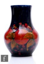 An early 20th Century William Moorcroft Pottery vase of shouldered ovoid form with drawn collar