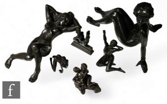 A large composite bronze figure of a girl reclining and five other erotic figures in various