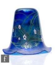 A single Okra glass lamp shade of bell form decorated with stylised flowers and whiplash lines to