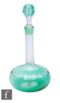 A late 19th Century Stevens & Williams green cased and flash cut decanter of compressed globe and