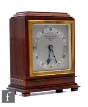 A mid 20th Century mahogany eight day Elliott  mantel clock, Roman numerals to a silver chapter ring