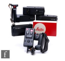 A collection of Leica camera accessories, to include winder M motordrive, R3 motor winder, R4