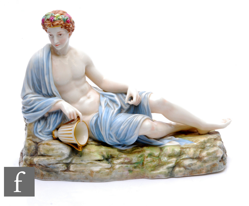 A later 19th Century Royal Worcester figure of Bacchus circa 1870, modelled as a reclining male