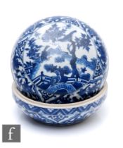 A Chinese 18th/19th Century blue and white circular box and cover, of rounded form,