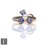 An early 20th Century 18ct and platinum sapphire, diamond and pearl ring set in a floral design,