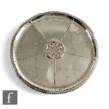 A hallmarked silver circular platter with central Tudor rose decoration within beaded borders,