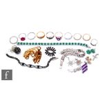 A parcel lot of costume and silver jewellery to include ten rings, four pairs of earrings, five