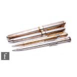 A silver fountain pen and matching biro, each with engine turned decoration, Cesare Emiliano, cased,