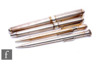 A silver fountain pen and matching biro, each with engine turned decoration, Cesare Emiliano, cased,