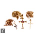 Three 9ct crosses and chains to include a diamond example and an amethyst set example, total