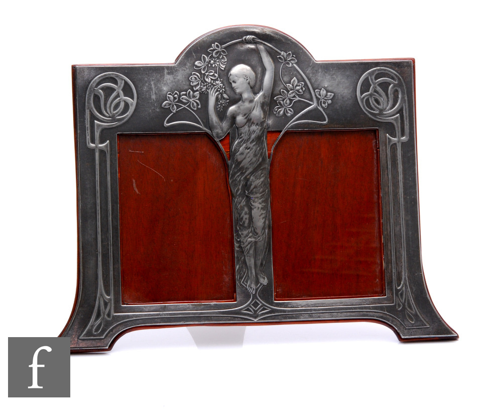 An WMF Catalogue number 32/2, Art Nouveau polished pewter double photograph frame with a central