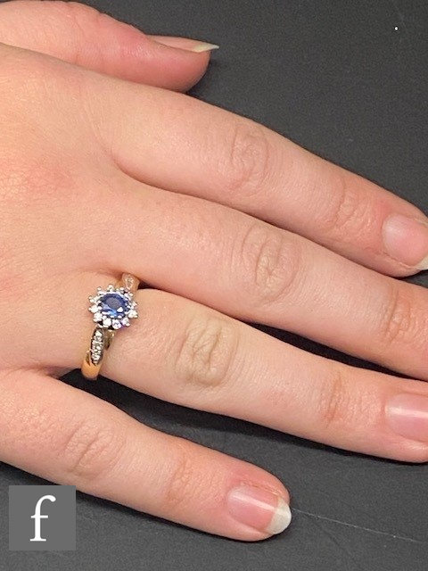 An 18ct sapphire and diamond cluster ring, central sapphire within a border of diamonds and - Image 5 of 5