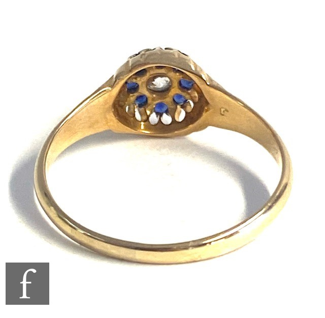 An early 20th Century 18ct sapphire and diamond cluster ring, central old diamond within a border of - Image 5 of 6
