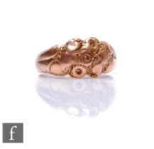 A 9ct rose gold ring with foliate decoration to centre, weight 4.2g, ring size Q 1/2, Birmingham