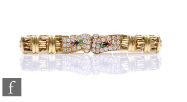 A 14ct fancy flexible link bracelet set with twin panels of brilliant cut diamonds, two rubies,