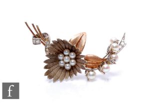 A mid 20th Century 9ct white and rose gold floral spray brooch set with cultured pearls and
