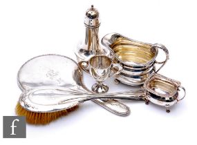 A small parcel lot of assorted hallmarked silver items to include a sugar castor, cream jug, small