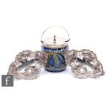 A pair of hallmarked silver shaped oval bon bon dishes, each with pierced decoration and raised on