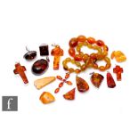A small parcel lot of assorted Baltic amber to include pendants, rings etc, with a row of similar