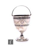 A hallmarked silver pedestal sugar basin with engraved swag and pierced decoration encompassing blue