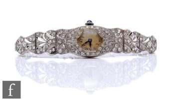 An early 20th Century lady's platinum diamond set manual wind cocktail watch, with Arabic numerals