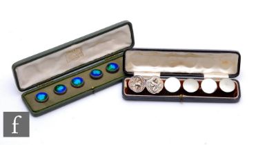 A cased set of five hallmarked silver buttons with blue/green enamel decoration, stamped Liberty and