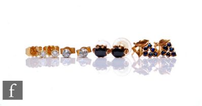 Two pairs of diamond stud earrings, old and brilliant cut examples, each approximately 0.10ct,