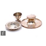 Three items of hallmarked silver to include a capstan ink well, diameter 15cm, a bon bon dish and