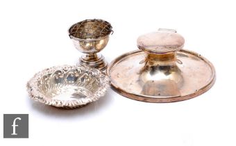 Three items of hallmarked silver to include a capstan ink well, diameter 15cm, a bon bon dish and