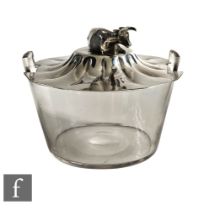 A hallmarked silver and clear glass butter dish, the glass base supporting a silver plated
