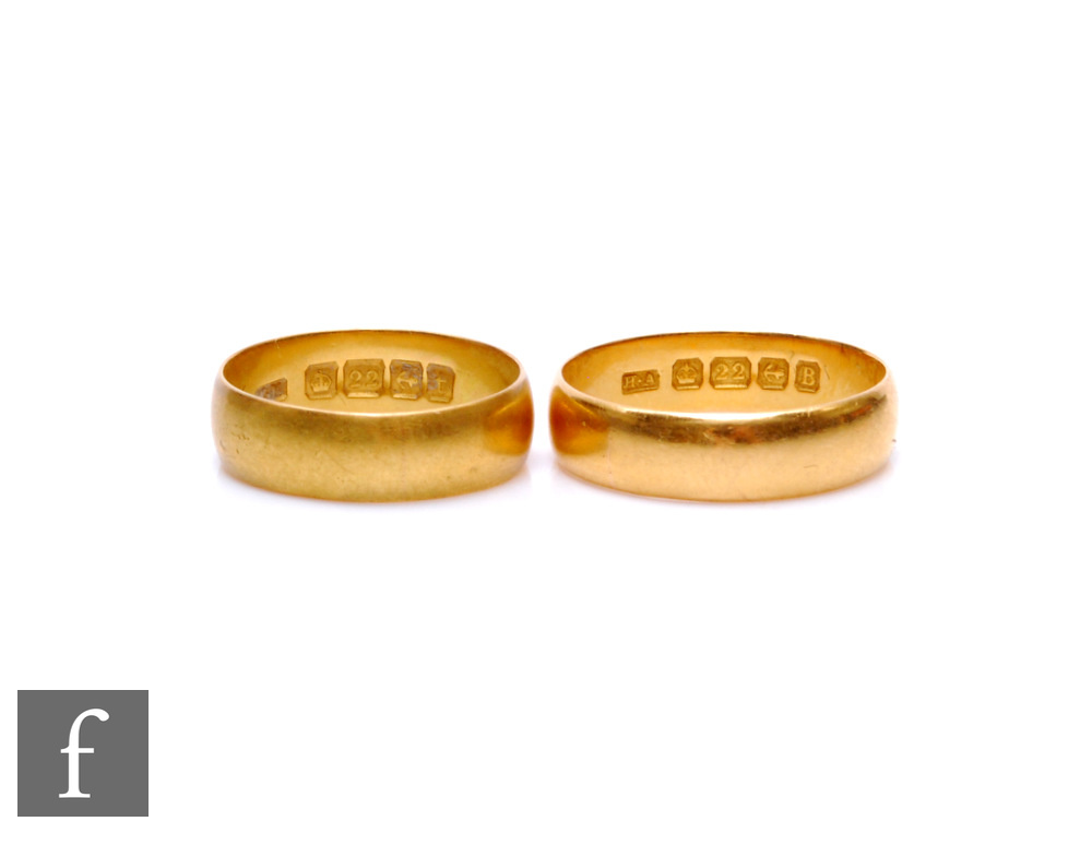 Two 22ct hallmarked D shaped wedding rings, both of plain form, total weight 8.2g. (2)