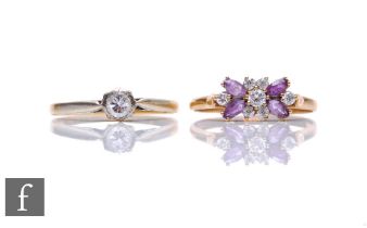 An 18ct diamond illusion set solitaire ring, weight 1.8g, with a 9ct amethyst and paste set
