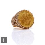 A 9ct hallmarked full sovereign ring, loose mounted coin dated 1979, total weight 21g, ring size W.