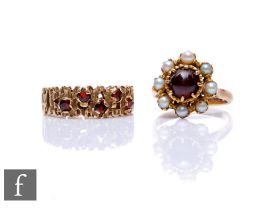 A 9ct garnet and seed pearl cluster ring with a similar 9ct pierced bark design ring, total weight