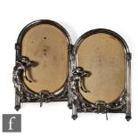 A pair of WMF silver coloured easel photograph frames, each with a classical maiden with