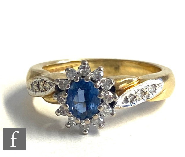 An 18ct sapphire and diamond cluster ring, central sapphire within a border of diamonds and - Image 3 of 5